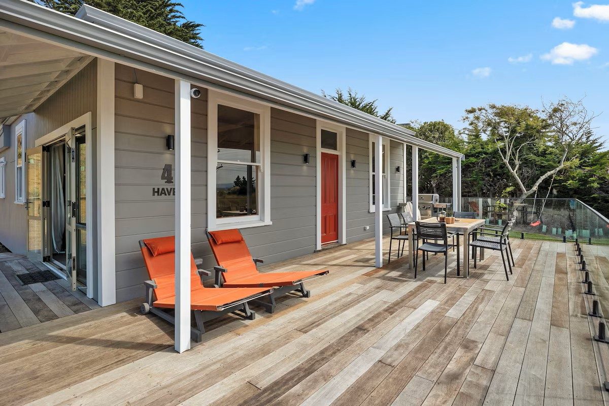 Exterior deck and outdoor seating at Moeraki Beach Haven