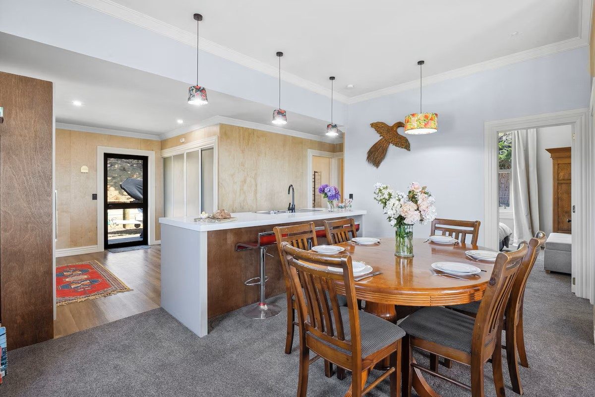 Open-plan dining and living area at Moeraki Beach Haven