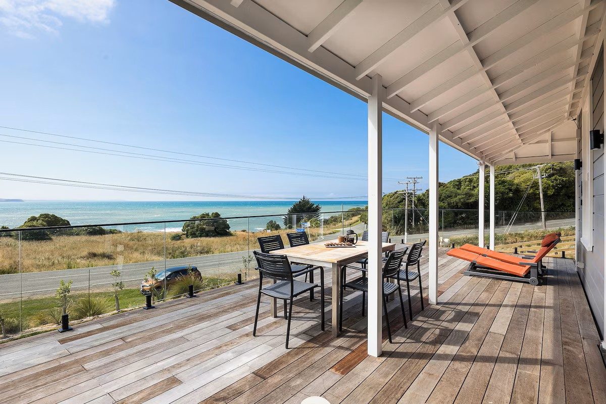 Moeraki Beach Haven deck with outdoor dining and ocean view