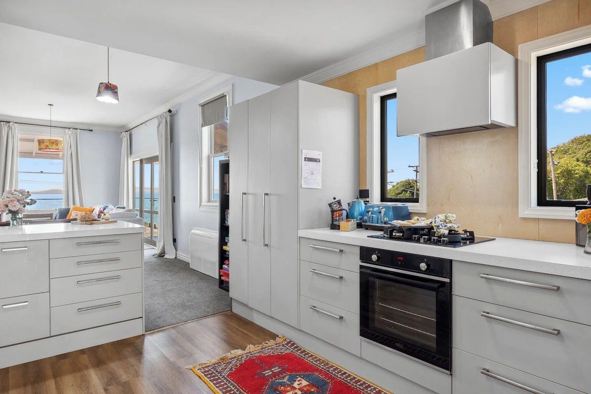 Kitchen island and entry at Moeraki Beach Haven